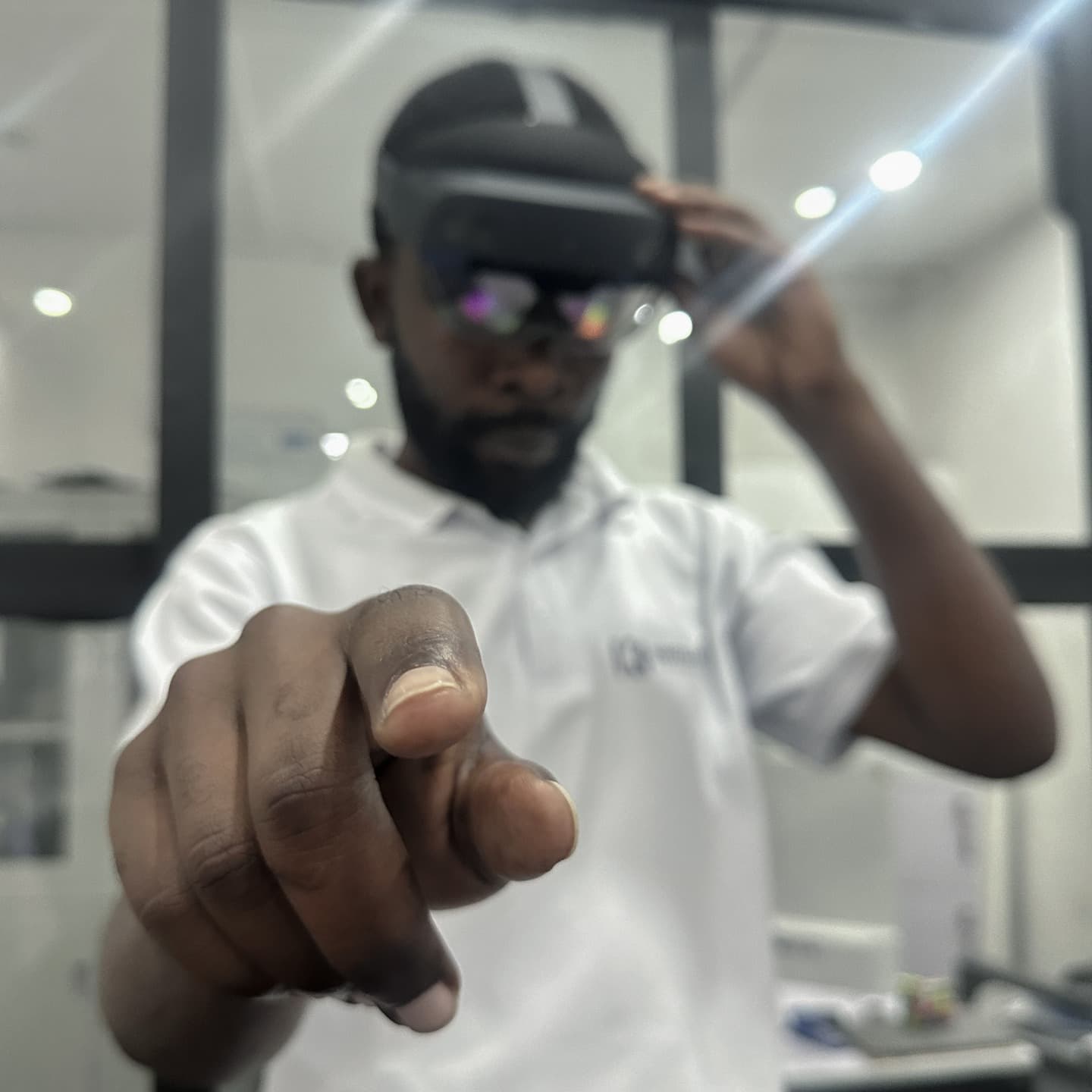 Kwetu Best staff member with a hollow lens on